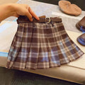 Girls' plaid pleated A-line skirt with an elastic waistband on a hanger.