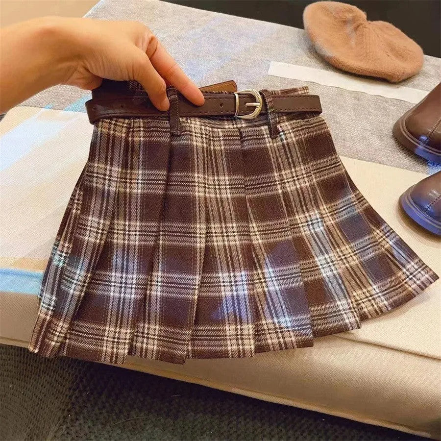 Girls' plaid pleated A-line skirt with an elastic waistband on a hanger.