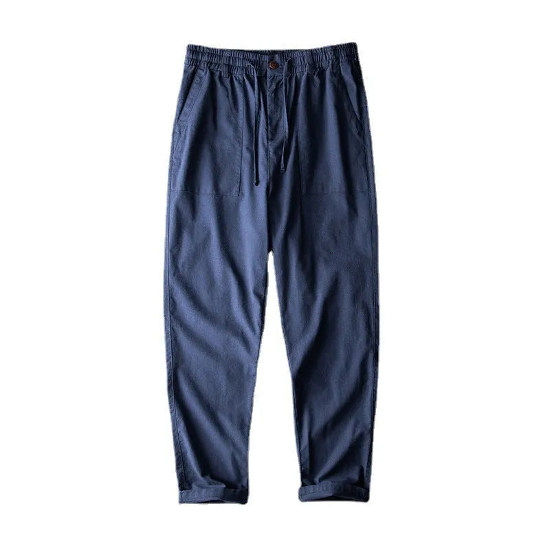 Men's casual linen trousers in a solid colour, shown in a mid-waist, full-length trouser style.