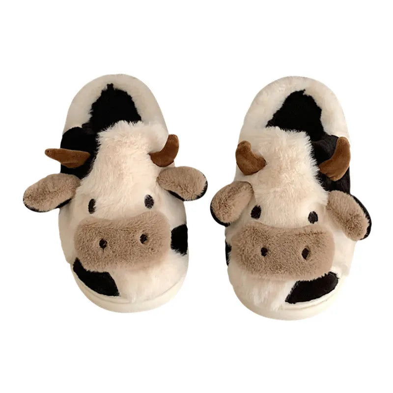 White cow design slippers with plush faux fur upper and textured non-slip sole