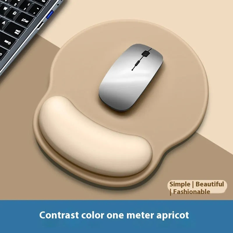 Silicone mouse mat with wrist rest in gradient colour pattern on desk