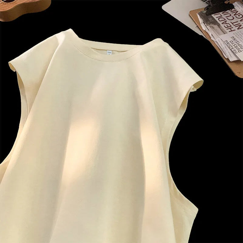 Men's loose cotton tank top in solid colours showing sleeveless design and straight hem