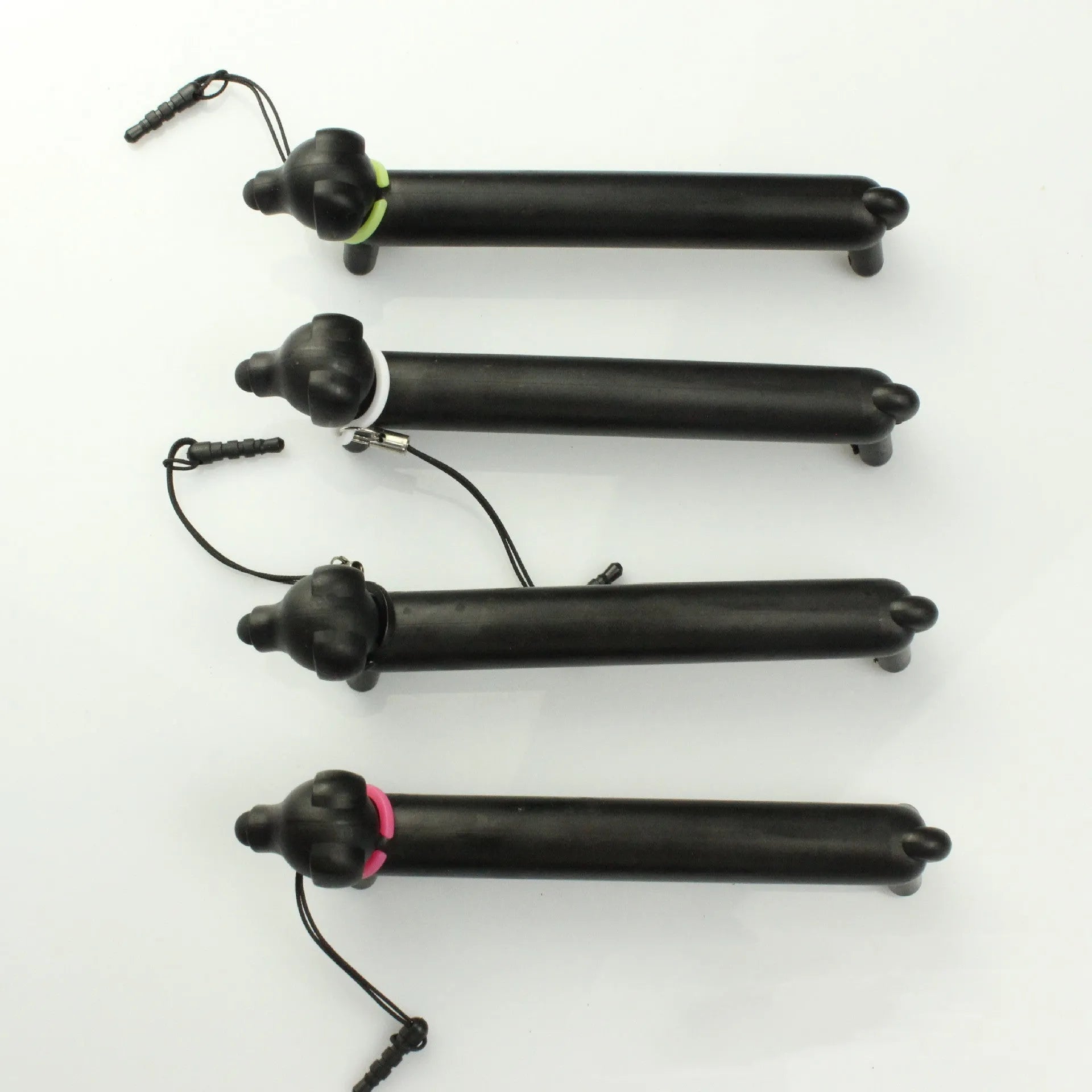 Black dog-shaped touch screen stylus with 12cm length shown on desk